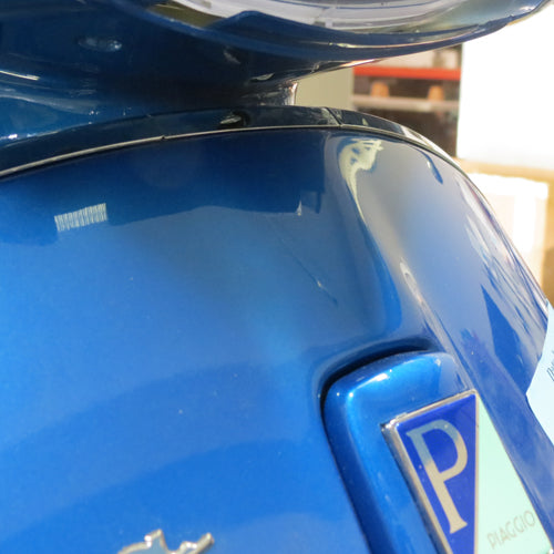 **CHROME** CENTER LEGSHIELD TRIM TOP PIECE (BELOW HEAD LIGHT)  - VESPA PRIMAVERA/SPRINT 50-150 (BEADING)