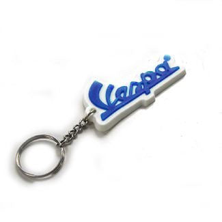 VESPA SCRIPT KEY CHAIN WHITE BACKGROUND BLUE LETTERING